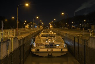 Lock on the Rhine-Herne Canal in Oberhausen-Lirich, at the blue hour, in the evening, ship in the