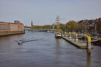 Weser with Martinianleger, Teerhof, Weser promenade and motorboat in Bremen, Hanseatic City, State