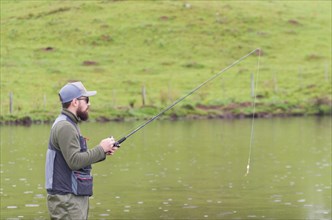 Black bass fisherman in close up, Cambara do sul, Rio Grande do sul, Brazil, South America