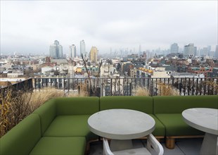 Roof terrace of The Penny Williamsburg hotel with a view of Brooklyn, New York City