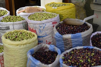 Bags filled with olives, Mardin bazaar, Turkey, Asia