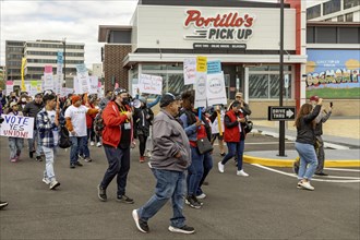 Rosemont, Illinois, Hundreds of workers and supporters picketed a Portillo's restaurant, demanding