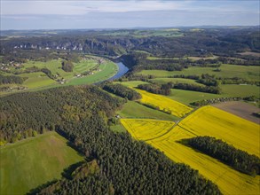 Rape fields in bloom on the Lilienstein with a view of the Bastei area on Rathen, Porschdorf,