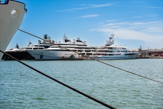 View of the marina of Tarragona with luxury yachts, clear blue sky and calm sea, Tarragona, Spain,