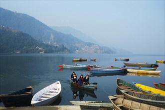 Schoolgirls going to school, juvenile, boating, lake Phewa, Pokhara, Nepal, Asia