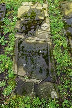 Weathered historical gravestone in the churchyard, Protestant Reformed St George's Church in the