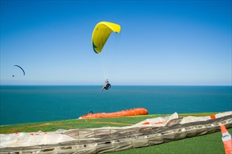 Camboriu, Brazil, December 10, 2017: Students practicing paragliding on the hill, South America