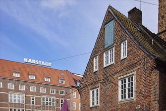 Karstadt department stores' and gable of a historic brick building in Bremen, Hanseatic city,