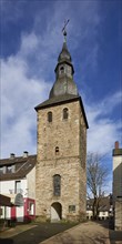 Bell tower of the former Johanniskirche against a blue sky with white clouds at the Untermarkt in