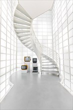 Modern, white spiral staircase in a bright, minimalist space, Deutsche Kinematik, Berlin, Germany,