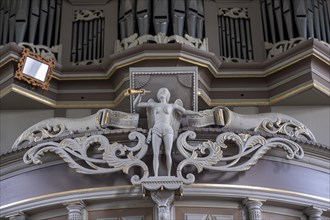 Trumpet angel on the organ facade in the Protestant Reformed Church from 1401 in Greetsiel,