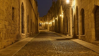 Knights Street, An empty, stone street at night, flanked by historic buildings, night shot, Rhodes