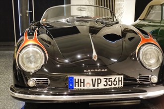 PORSCHE 356 A SPEEDSTER, A black Porsche presented with an eye-catching flame design, AUTOMUSEUM