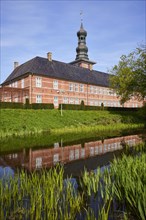 Castle in front of Husum with reflection in the castle moat in Husum, North Friesland district,