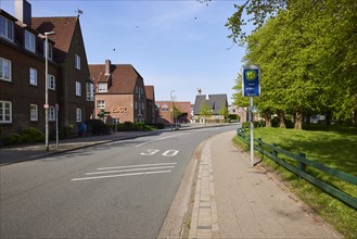 Street with zone 30 marking and bus stop Schloss in Husum, district of Nordfriesland,