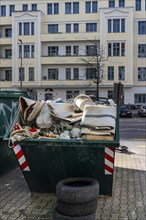 Container with building material at the roadside, Berlin, Germany, Europe