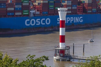 Cosco container ship and lighthouse on the Elbe, Blankenese district, Hamburg, Germany, Europe