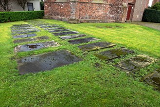 Weathered historical gravestones in the churchyard, Protestant Reformed St George's Church in the