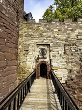 View over a fortified bridge to a small, narrow castle courtyard of the 13th century Trendelburg