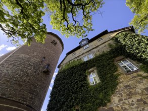 Steep view from castle courtyard upwards to left tower castle tower Rapunzel tower of Trendelburg