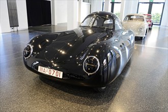 1939 PORSCHE TYP 64 VW TYP 60, A black Porsche sports car exhibited in a bright hall, AUTOMUSEUM