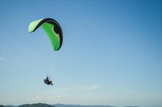 Camboriu, Brazil, December 10, 2017: Students practicing paragliding on the hill, South America