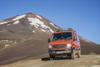 Campervan in front of the Lonquimay volcano, Lonquimay volcano, Malalcahuello National Reserve,