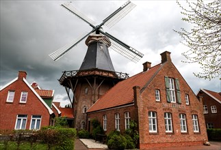 Historic mill and miller's house in the fishing village of Ditzum, municipality of Jemgum, district
