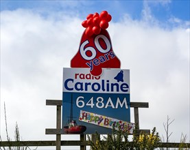 Radio Caroline pirate radio station 60 years old happy birthday balloons and poster, Suffolk,