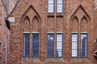 Windows and arched decorations on a brick house in Boettcherstrasse in Bremen, Hanseatic city,