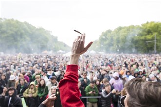 Participants smoke a joint at 16:20 (4:20 pm) at the 420 legalisation party at the Brandenburg