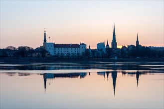 Morning atmosphere on the Daugava River with Riga Castle, seat of the Latvian President, and St
