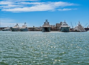 View of the marina of Tarragona with luxury yachts, clear blue sky and calm sea, Tarragona, Spain,