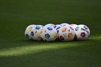 Adidas Derbystar match balls lie on grass, Allianz Arena, Munich, Bavaria, Germany, Europe