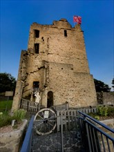 Photo at dusk of historic ruins of Romanesque residential tower of former moated castle from 12th