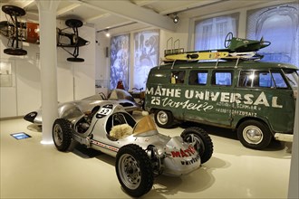 Classic racer next to a Volkswagen bus with advertising in a car museum, AUTOMUSEUM PROTOTYP,