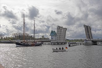 Sailing ship passes through open bascule bridge, Kappeln, Schlei, Schleswig-Holstein, Germany,