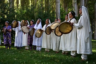 Pamiri women playing music, roof of the world festival, Khorog, Tajikistan, Central Asia. All the