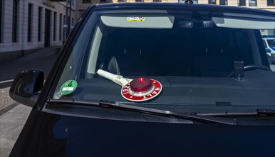 Parked police vehicle with red stop stick behind the windscreen, Berlin, Germany, Europe