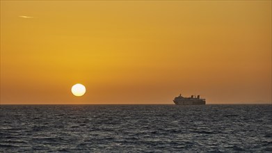 View of a ferry against the backdrop of a spectacular sunset, dusk, sunset, Rhodes, Dodecanese,