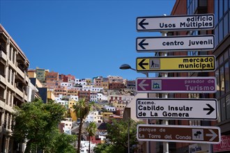 Signposts on a alleyway in the city centre of San Sebastian de la Gomera, behind the alleyway