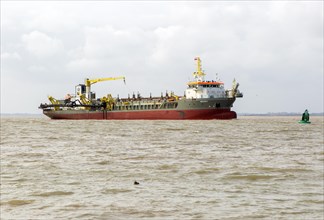 Medway ship Hopper Dredger vessel, approaching port of Harwich, River Orwell Stour estuary, Suffolk