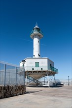 Far de la Banva lighthouse on the Moll de Llevant promenade, a 4.5 km long promenade for joggers,