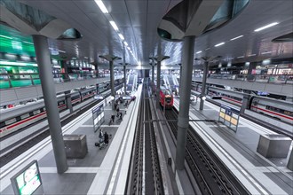 Interior of a modern railway station with several platforms and people travelling, Berlin, Berlin