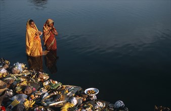 Two hindu wives, worshipping the Sun god, celebrating Chhath puja, festival, nepal