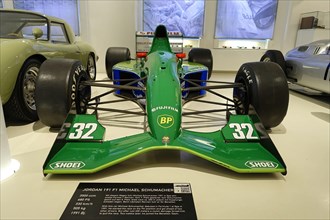 JORDAN 191 F1 Michaels Schumacher's green Jordan Formula 1 car displayed in a car museum,