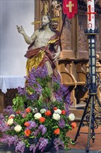 Jesus figure with floral decoration, St Martin's Church, Kaufbeuern, Allgaeu, Swabia, Bavaria,