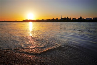Sunset over the Rhine in Neuss with a view of Volmerswerth in Duesseldorf, Lower Rhine, North