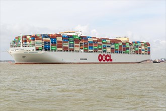 OOCL Zeebrugge container ship leaving quayside departing from Port of Felixstowe, Suffolk, England,
