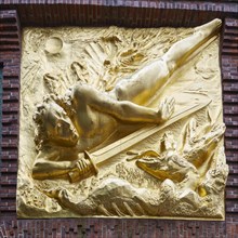 Gilded relief The Lightbringer by sculptor Werner Hoetger at the entrance to Boettcherstrasse in